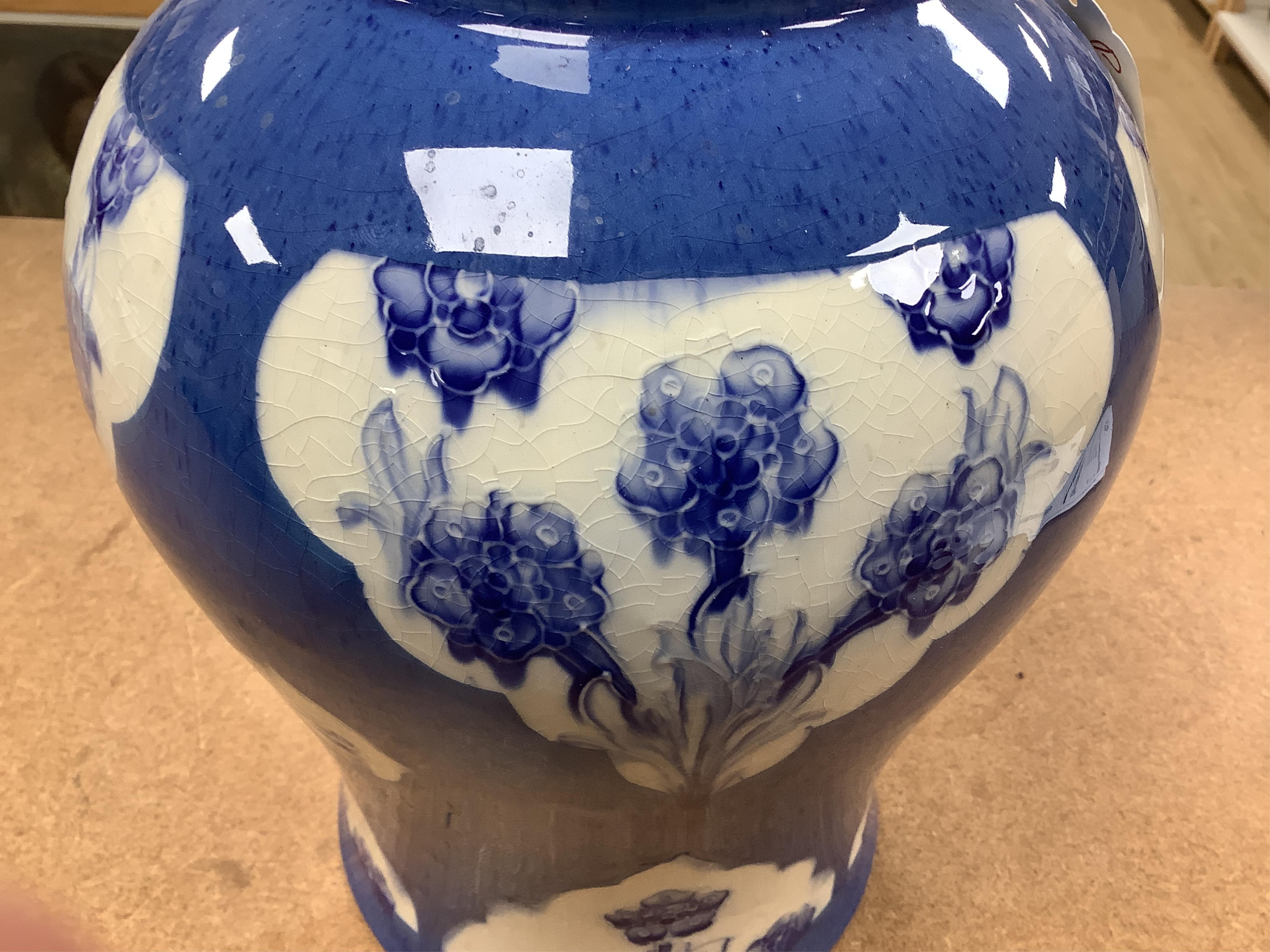 A large Moorcroft late Florian forget-me-nots powder blue temple jar, 29cm high. Condition - fair, chip to base